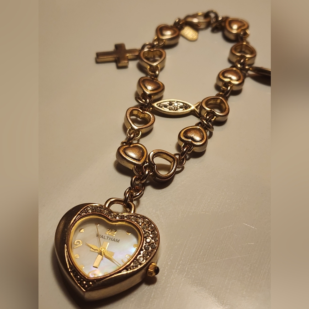 vintage gold-tone charm bracelet with Waltham heart watch